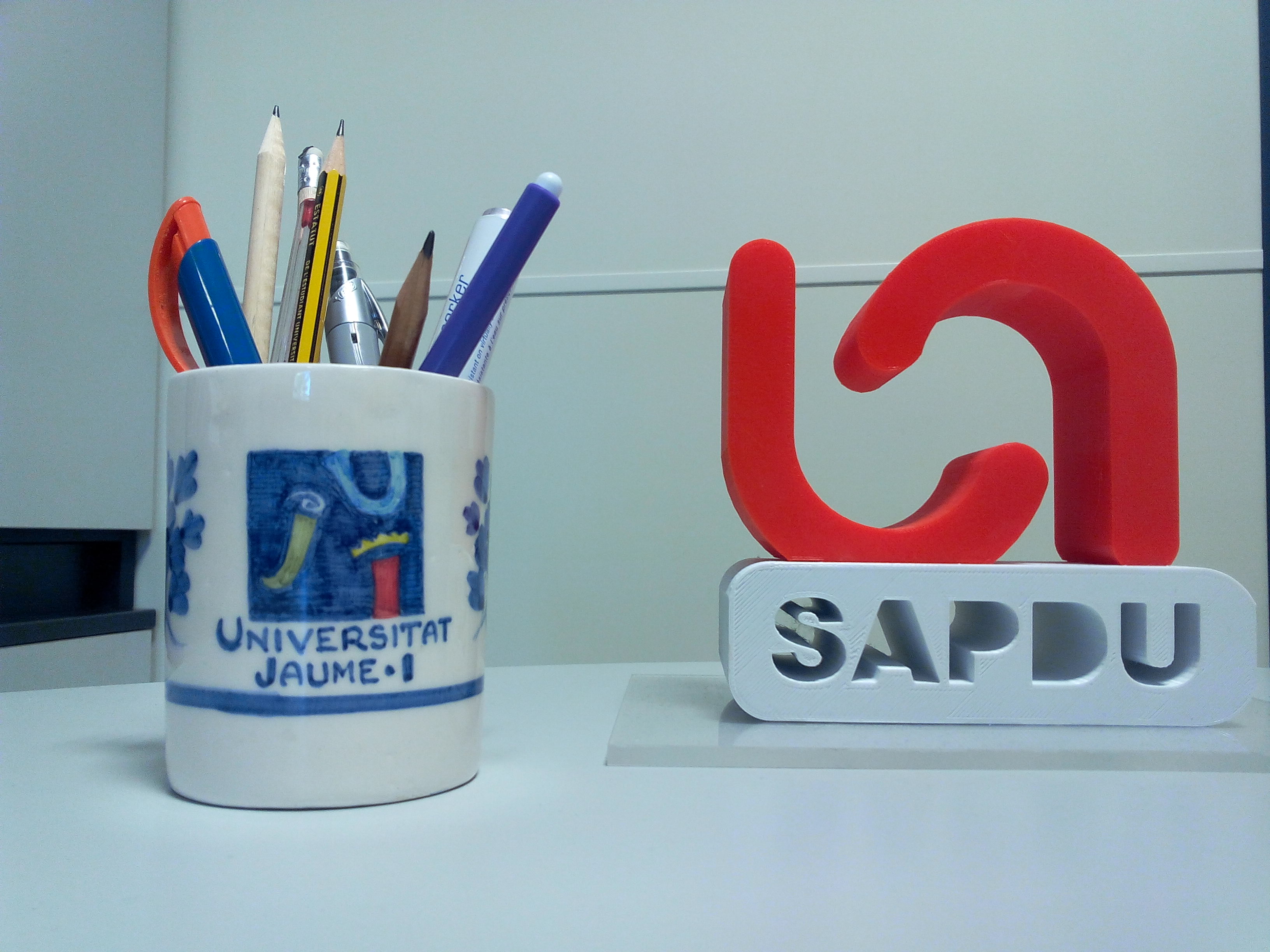 iconos de representación de la Universidad Jaume I y SAPDU